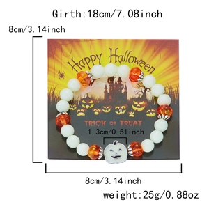 Detailed view of Halloween beaded bracelet featuring luminous beads and orange pumpkin charm