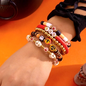 Detailed layered Halloween bracelets featuring skulls, ghosts, and BOO letter beads