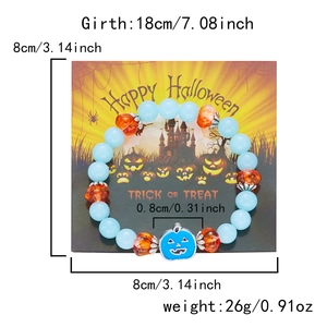 Glow-in-the-dark Halloween beaded bracelet featuring orange pumpkins and blue ghost charm