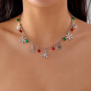 Detailed view of Christmas necklace with colorful bells and sparkling rhinestone snowflakes