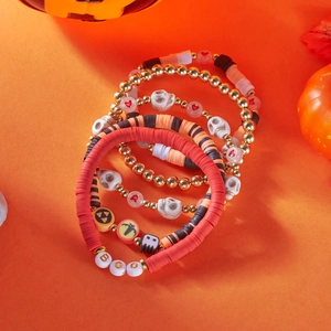 Detail of Halloween beaded bracelet set featuring clay beads and spooky charms