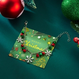 Christmas necklace and bracelet set with snowflake pendants and colorful bells on green silk