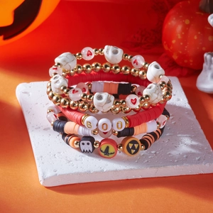 Detail of Halloween beaded bracelet set with skull charms and BOO letter beads