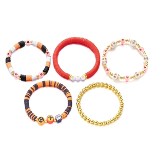 Detail of Halloween beaded bracelet set featuring ghost and pumpkin charms with BOO letters