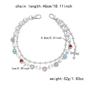 Detailed view of hip hop pant chain with pearls, crosses, and colorful heart pendants