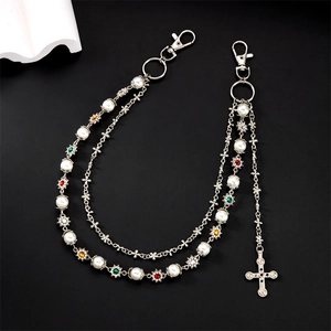 Detailed layered hip hop pants chain featuring pearls, rhinestones, and a silver cross charm