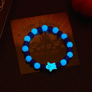 Glow-in-the-dark Halloween beaded bracelet with luminous ghost charm and dark purple beads