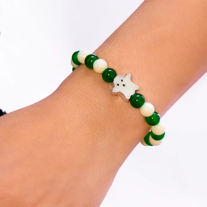 Detailed view of Halloween beaded bracelet featuring a ghost charm and glowing beads