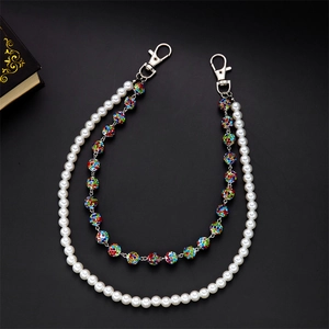 Detail of double-layer chain with white faux pearls and colorful rhinestone balls