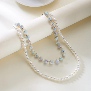 Close-up of double-layered hip-hop pants chain with white pearls and rainbow crystal balls