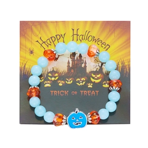 Glow-in-the-dark Halloween beaded bracelet with pumpkin charm on festive card
