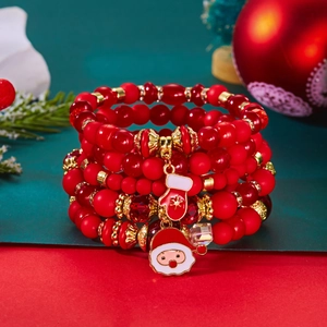 Détail du lot de bracelets de Noël à perles rouges avec breloques Père Noël en émail