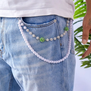 Close-up of double-layered hip hop pant chain with pearls and green rhinestone balls
