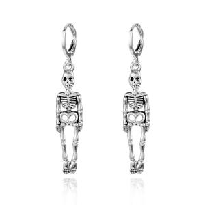 Detail view of silver skeleton earrings with vintage finish and round hoop clips
