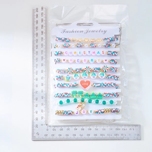 Detailed size view of a 10-piece Christmas clay bead bracelet set with holiday charms
