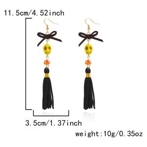 Halloween skull tassel earrings with black bow and yellow beads in long gothic style