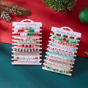 Detail of Christmas beaded bracelet set with snowman and tree charms on card