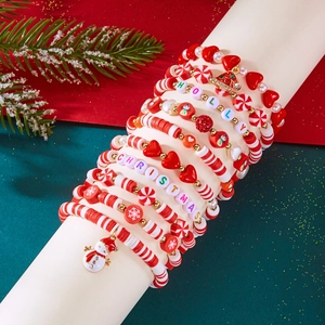 Christmas beaded bracelet set with snowman and snowflake charms on white display