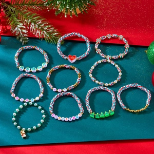Detail of 9-piece Christmas clay bead bracelet set with festive charms and holiday motifs