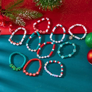 Close-up of Christmas beaded bracelet set with Merry and Happy holiday charms