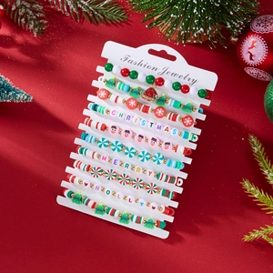 Close-up of a 10-piece Christmas bead bracelet set with polymer clay and holiday charms