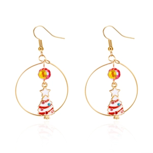 Detail showing gold alloy Christmas tree earrings with colorful beads and white enamel finish
