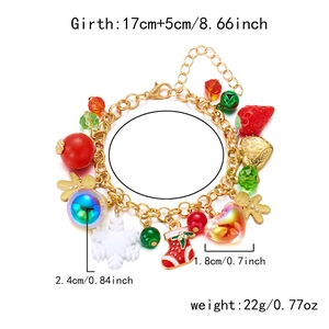 Detailed view of Christmas charm bracelet with snowflake, reindeer and tree pendants