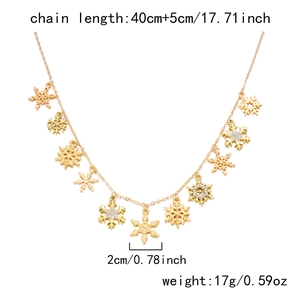 Golden snowflake necklace detail showing 2cm pendant size and 45cm adjustable chain length