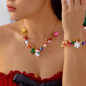 Close-up of a festive Christmas jewelry set with colorful charms worn by a model