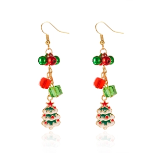 Macro detail of Christmas tree earrings with colorful beads and festive bells