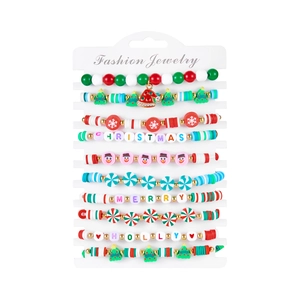 Detail of Christmas beaded bracelet set with polymer clay charms and holiday patterns