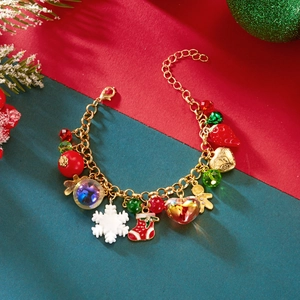 Close-up of Christmas charm bracelet with snowflake, ginger man and festive beads