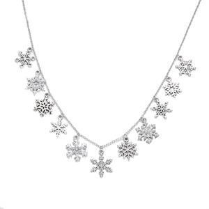 Detail of silver Christmas necklace featuring ten snowflake charms with sparkling crystals