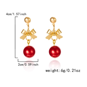 Detail of red bead earrings with golden bowknot and elegant festive pearl style