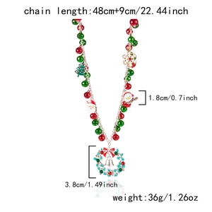 Vue détaillée du collier de Noël avec cloches, breloques festives et dimensions