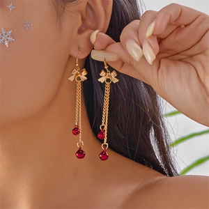Golden bow earrings with red bells and long tassel fringes for Christmas fashion