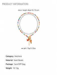 Detail view of handmade beaded necklace with fish and starfish pendants and OT clasp