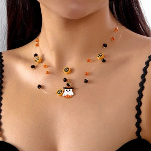 Detail of multi-layer Halloween necklace featuring ghost pendant and festive beads