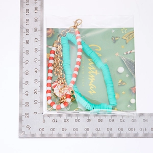 Detailed view of festive three-piece Christmas bracelet set with measuring scale