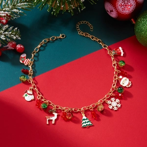 Detailed view of Christmas charm bracelet with Santa, tree, and reindeer pendants