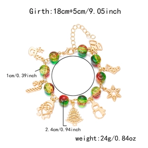 Detailed view of Christmas charm bracelet with red green beads and holiday pendants
