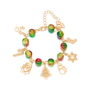 Christmas charm bracelet with Santa Claus and snowflake pendants on a gold chain