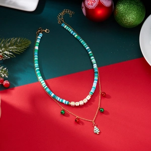 Detail of double-layer Christmas necklace with bell charms and enamel tree pendant