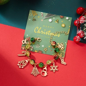 Christmas charm bracelet with red green beads and festive Santa reindeer pendants