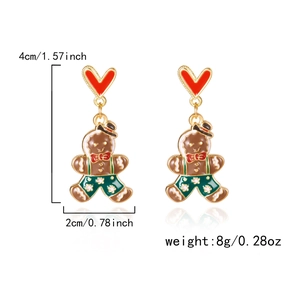 Détail des boucles d'oreilles bonhomme de pain d'épice avec dimensions de 4cm x 2cm