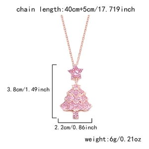 Detailed specs of rose gold Christmas tree necklace with pink crystals and star pendant