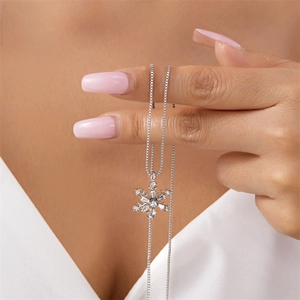 Elegant silver snowflake necklace with baguette-cut zircons and classic box chain