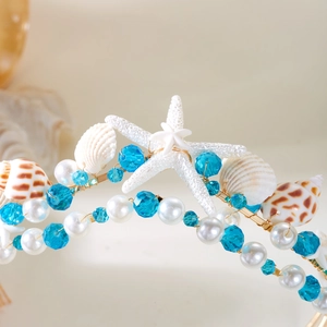 Detail of mermaid headband with seashells, starfish, pearls, and hand-woven gold wire