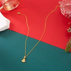 Detail view of a gold Christmas tree pendant necklace with shimmering cubic zirconia stones