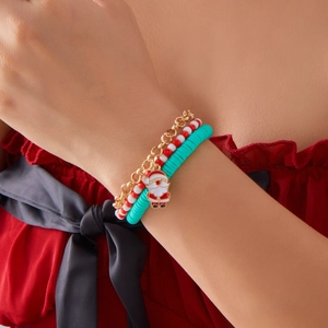 Three-piece Christmas charm bracelet set with Santa Claus and snowflake pendants on wrist